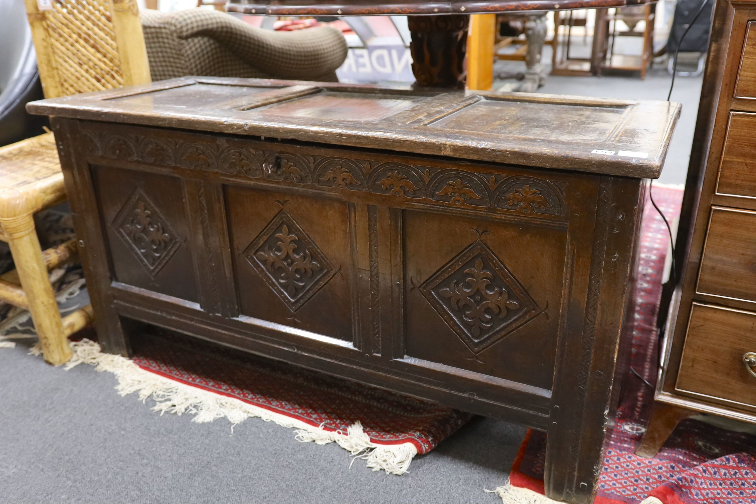 A late 17th century carved oak coffer, length 134cm, depth 54cm, height 68cm